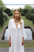 Load and play video in Gallery viewer, Blonde beauty wearing pure silk kaftan dress Onassis in transparent white