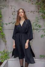 Load image into Gallery viewer, Beautiful brunette Russian model wearing silk satin kimono dress called Anatolé in matte black color. Front view image. Nynolia brand.