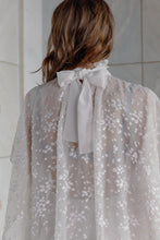 Load image into Gallery viewer, Brunette model wearing sustainable silk chiffon blouse Papillon in white color rear view
