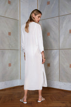Load image into Gallery viewer, Blonde beauty wearing pure silk kaftan dress Onassis in white color rear view