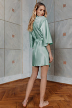 Load image into Gallery viewer, Blonde girl wearing satin silk dress Chloe Uncut in mint color rear view
