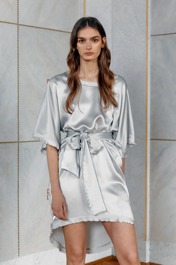 Brunette model wearing silver silk dress Celine