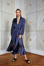 Load image into Gallery viewer, Blonde girl wearing v neck satin silk dress in night blue color front view
